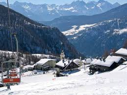 Chamois ski resort in Aosta Valley, Italy - panoramic view of ski slopes and mountain facilities