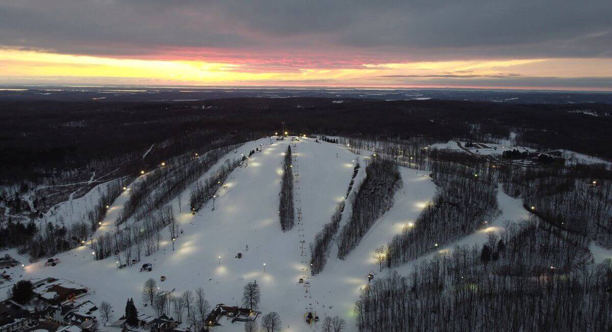 Shanty Creek ski resort in Bellaire, Michigan, USA - panoramic view of ski slopes and mountain facilities