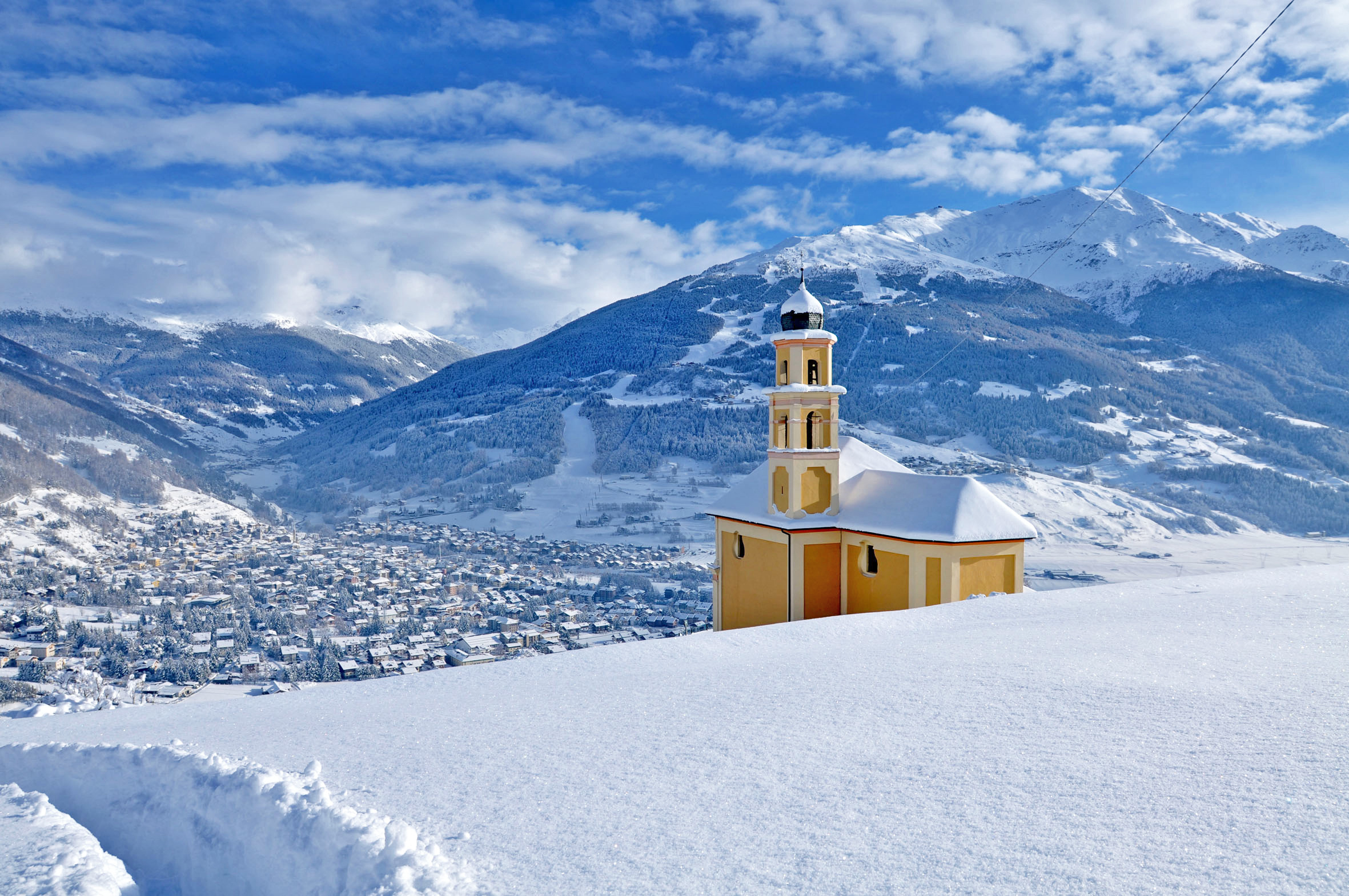 Bormio ski resort in Lombardy, Italy - panoramic view of ski slopes and mountain facilities