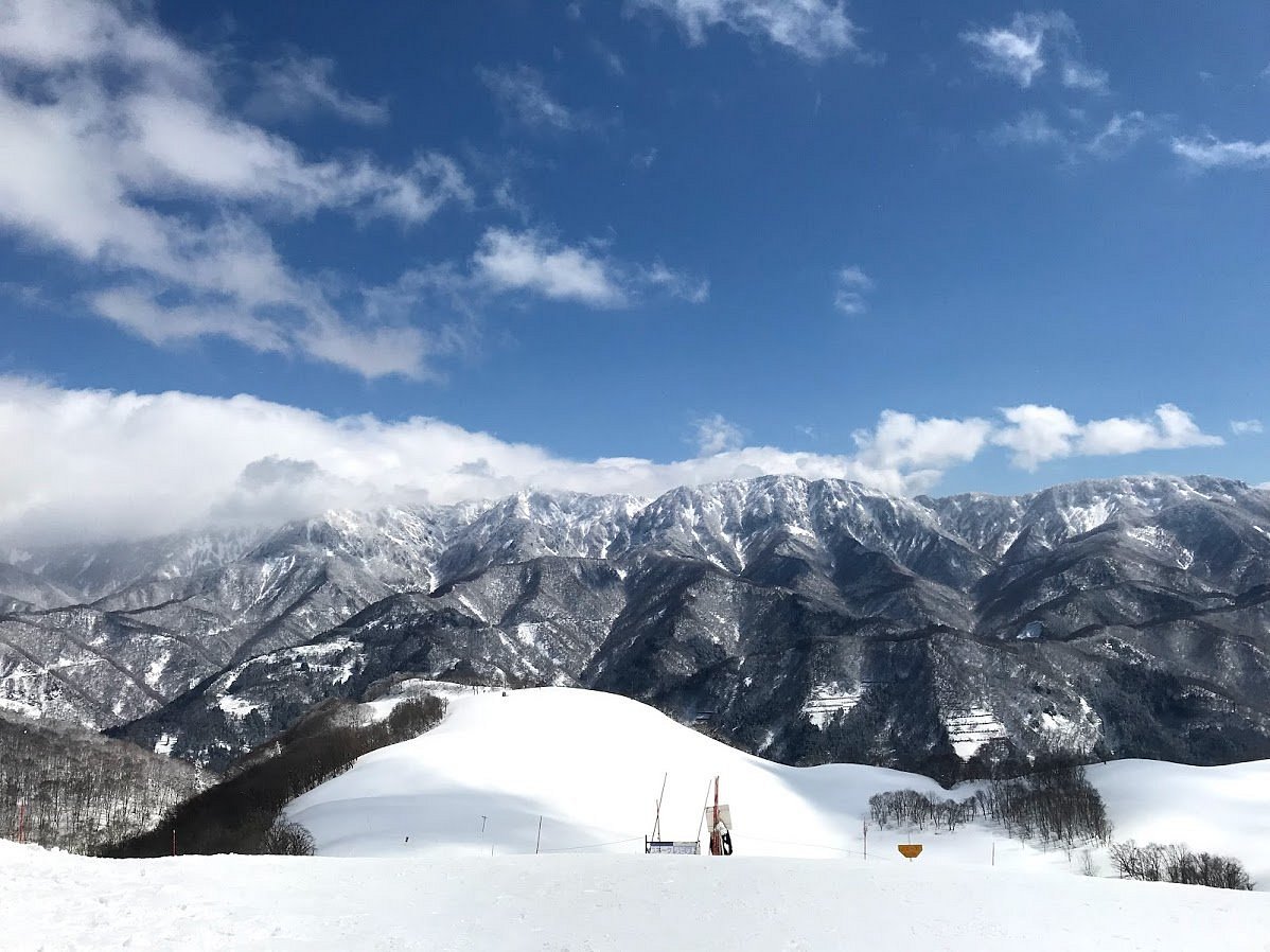 Cortina Nagano ski resort in Nagano Prefecture, Japan - panoramic view of ski slopes and mountain facilities