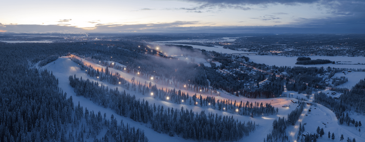 Ounasvaara ski resort in Rovaniemi, Lapland, Finland - panoramic view of ski slopes and mountain facilities