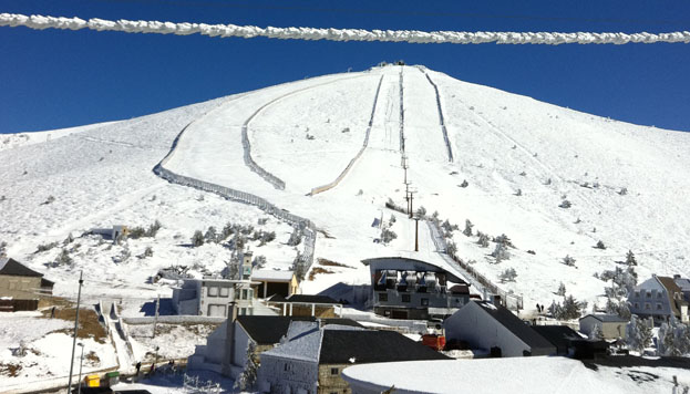 Puerto de Navacerrada ski resort in Madrid/Segovia, Spain - panoramic view of ski slopes and mountain facilities