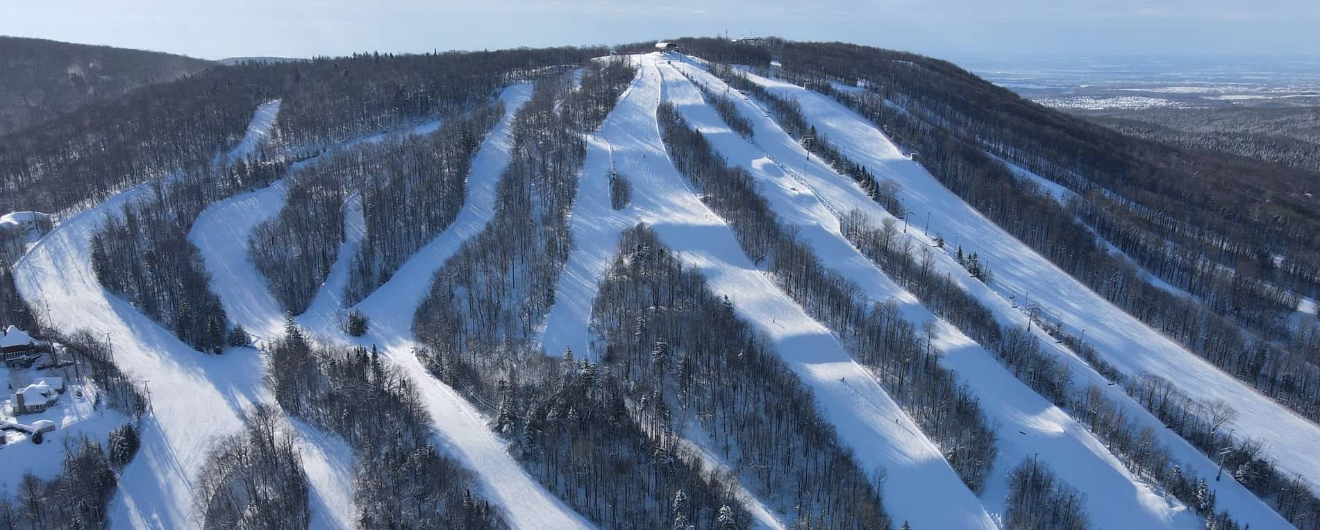 Le Relais ski resort in Quebec, Canada - panoramic view of ski slopes and mountain facilities
