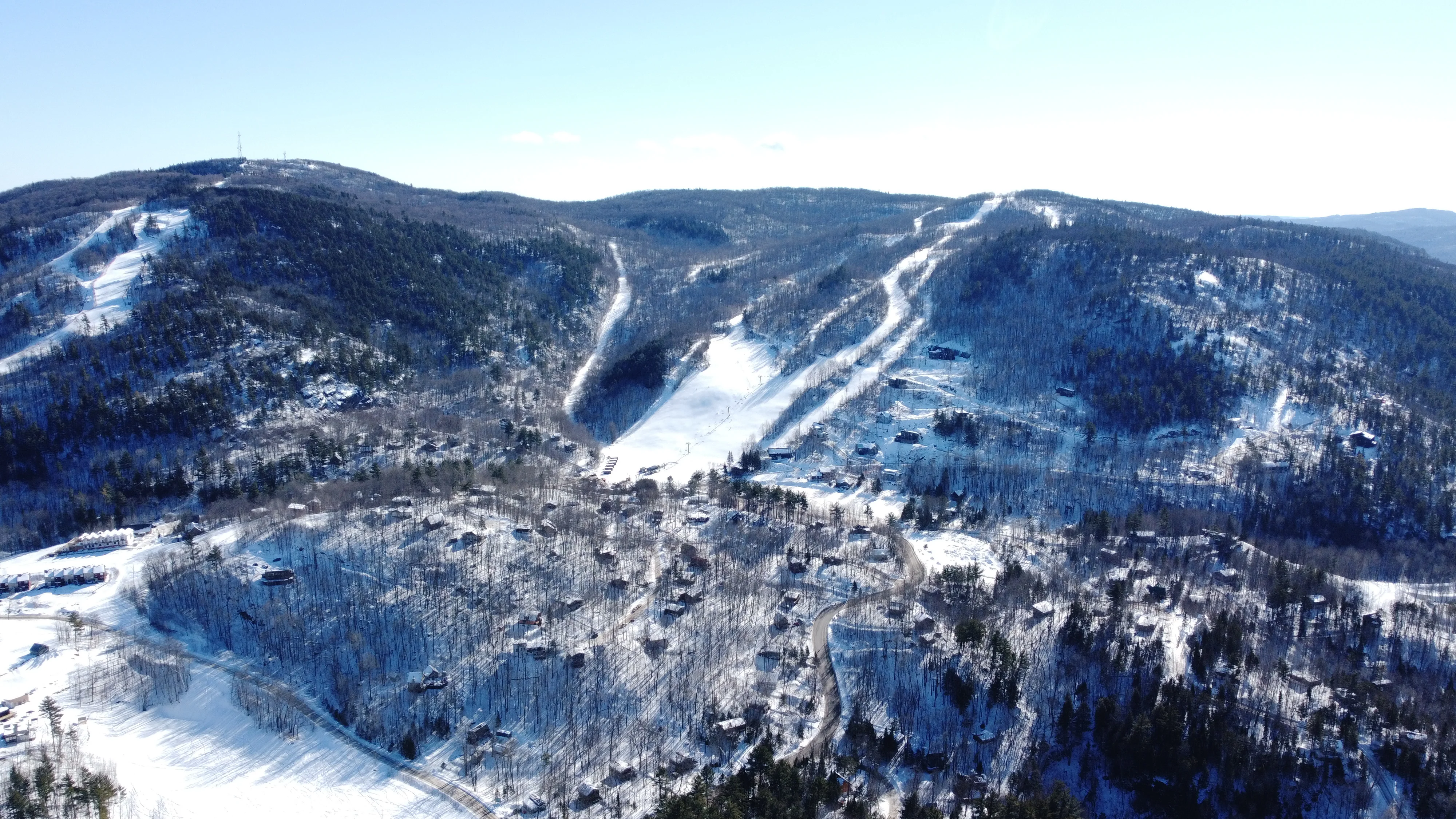 Mont Sainte-Marie ski resort in Quebec, Canada - panoramic view of ski slopes and mountain facilities