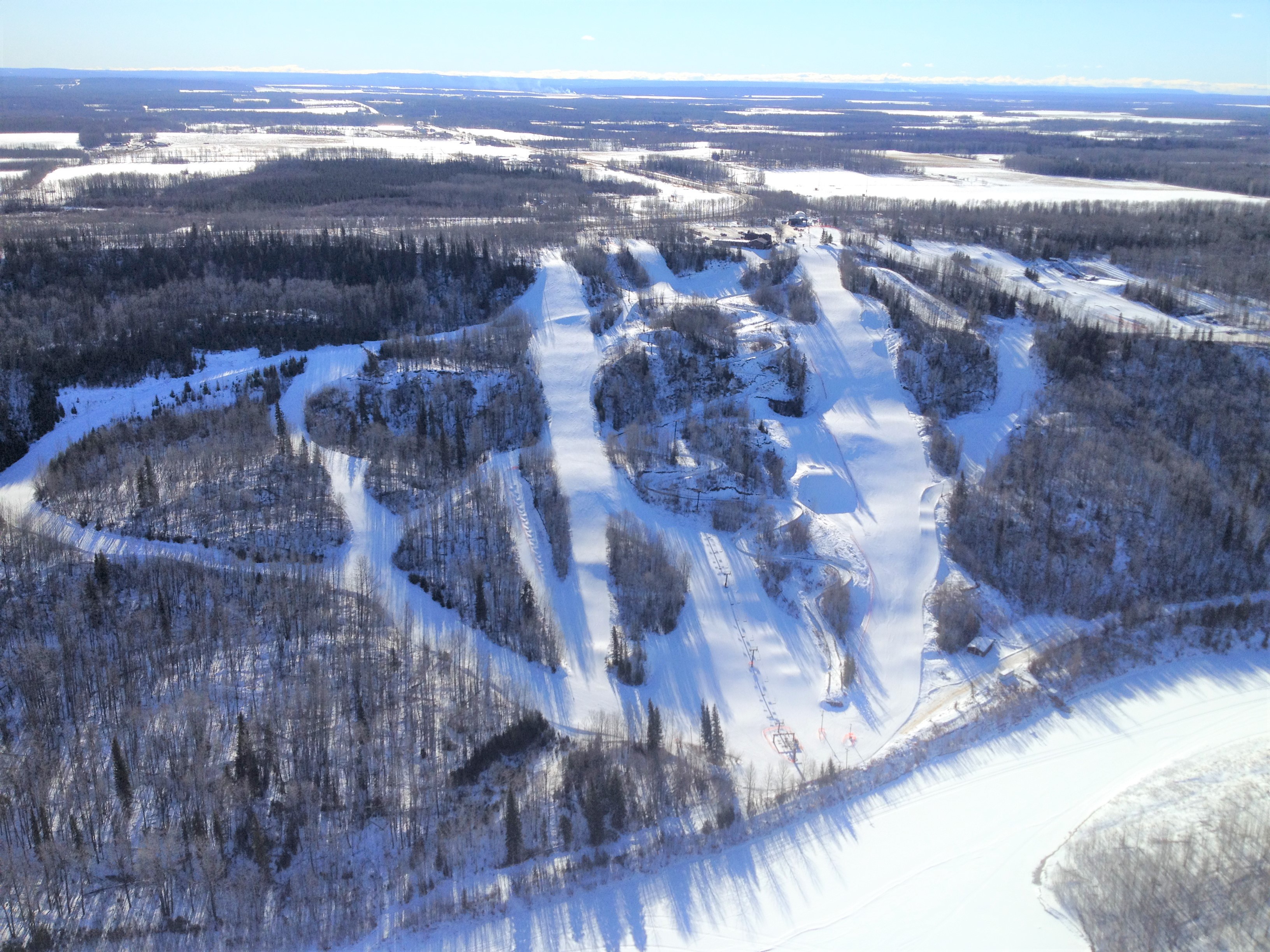 Nitehawk Year Round Adventure Park ski resort in Alberta, Canada - panoramic view of ski slopes and mountain facilities