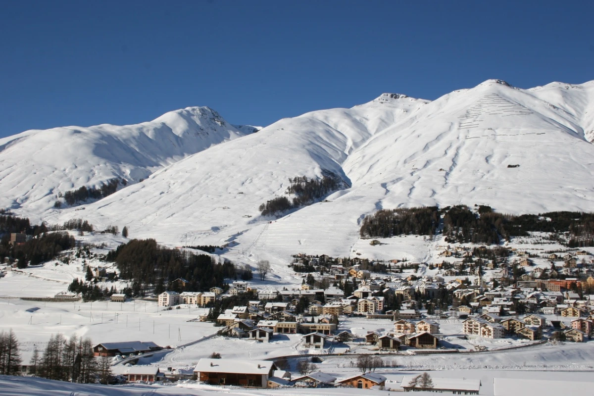 Zuoz-Madulain ski resort in Engadin, Graubünden, Switzerland - panoramic view of ski slopes and mountain facilities